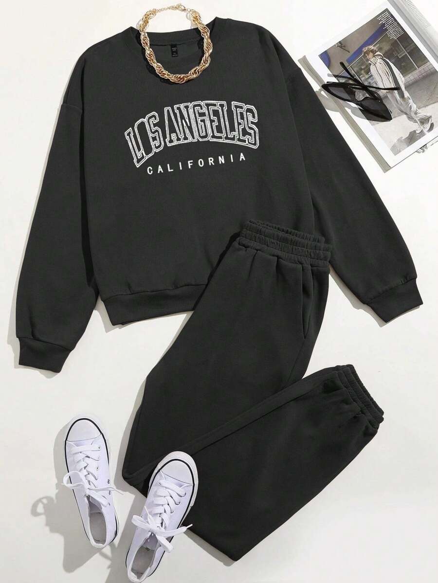 Flirla Set informal de 2 piezas de talla grande con top de manga larga y cuello redondo y pantalones, con estampado de letra en un estilo minimalista
