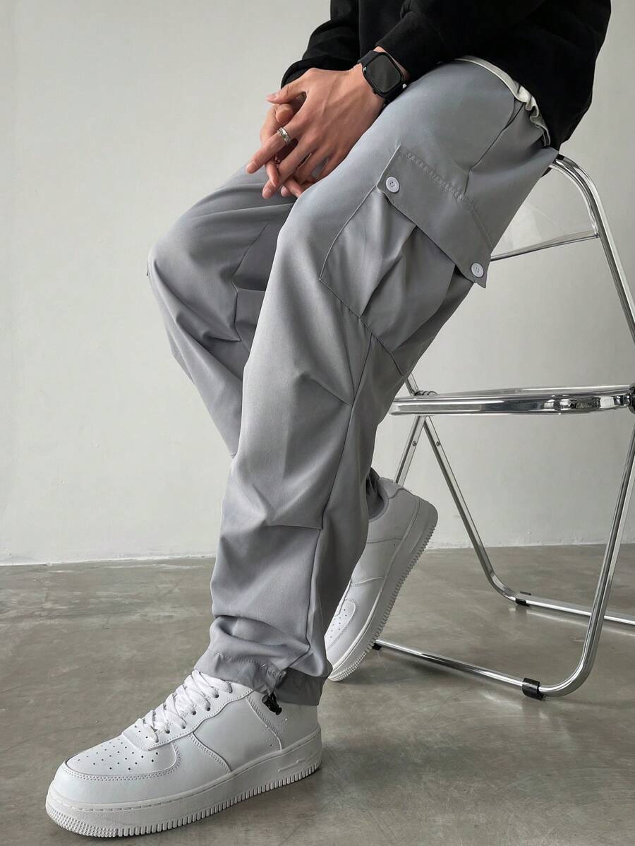 Manfinity Homme Pantalones anchos de talla grande con bolsillo con solapa, cintura con cordón y unicolor, estilo urbano para hombre