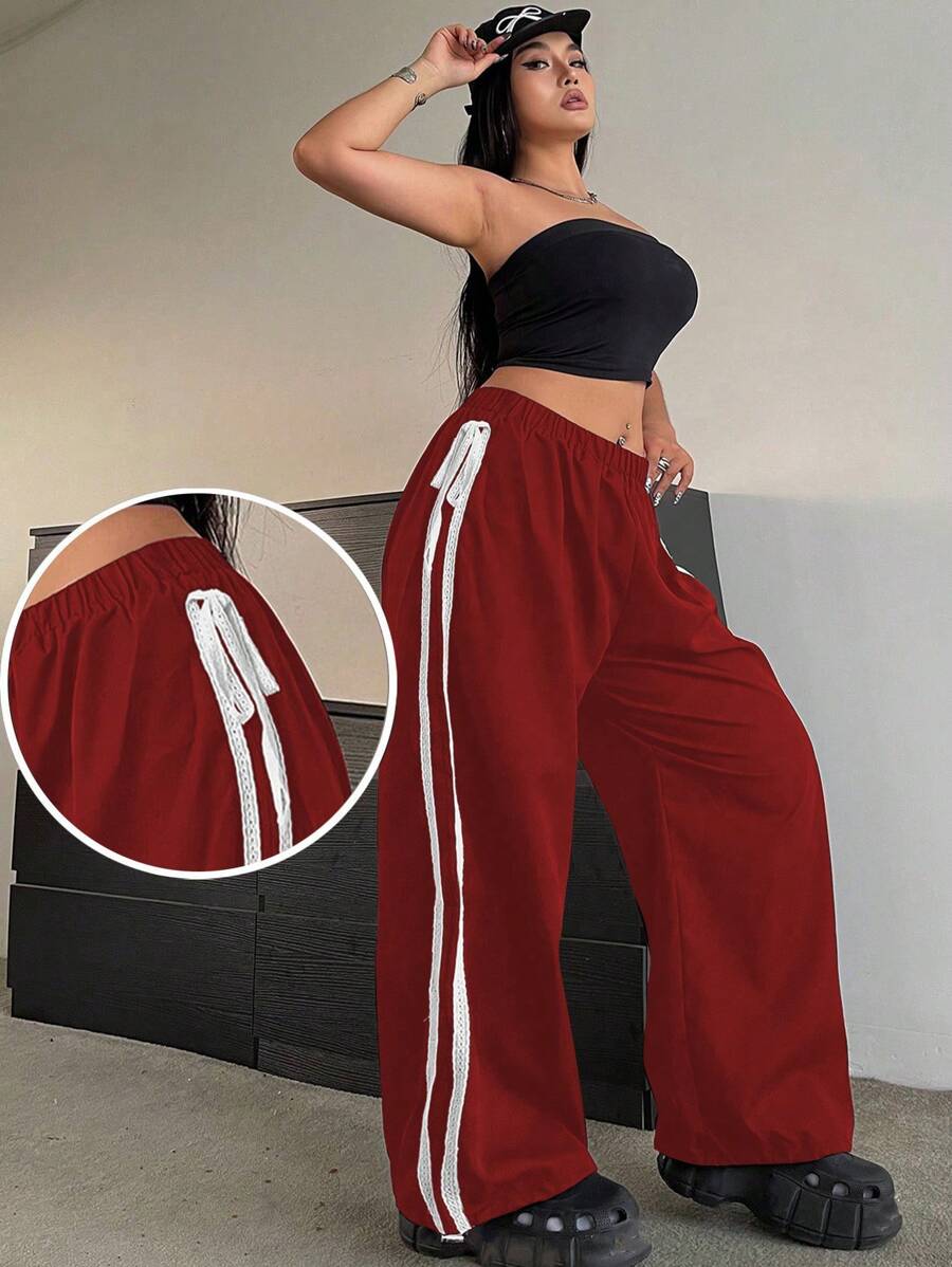 Flirla Pantalones con dobladillo para mujer de talla grande, con bordado en la costura lateral, cintura elástica con cordón ajustable y tobillos