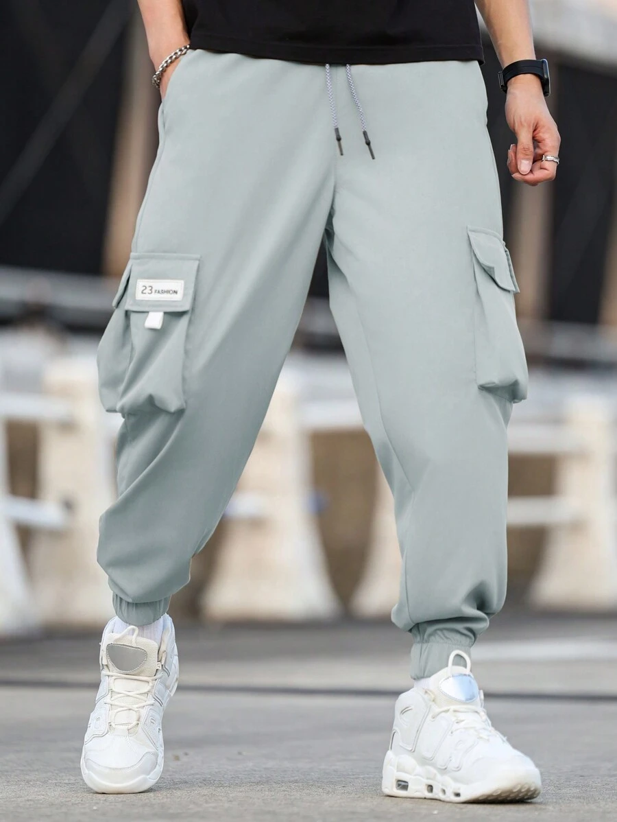 Manfinity Homme Men Plus Size Loose Fit Letter Patched Detail Flap Pocket Drawstring Waist Cargo Pants