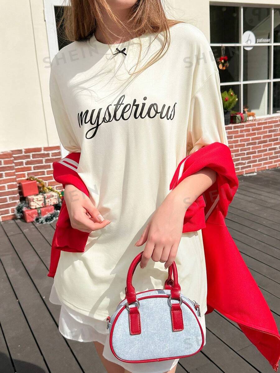 Jouncy Camiseta casual holgada de mujer con cuello redondo, mangas cortas caídas, estampado de letras místicas en posicionamiento 3D y lazo oversize