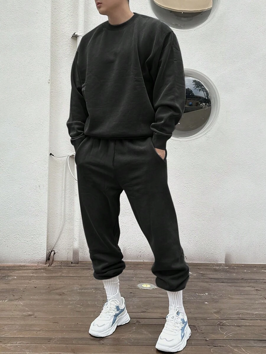 Set de 2 piezas Sudadera de cuello redondo de un solo color y pantalón de chándal casual para hombre, otoño