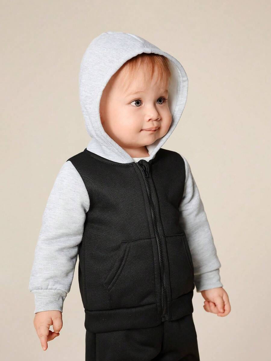 SHEIN This 2-Piece Set Includes A Hooded Zip-Up Sweatshirt Jacket And Solid Color, Adjustable Waist Pants, Providing Warmth And Comfort For Baby Boys During The Spring And Autumn Seasons. The Set Is Suitable For Both Outdoor Wear And Indoor Wear, And Can Be Paired With Various Outfits For Different Occasions. This Versatile And Durable Set Allows Baby Boys To Stay Stylish And Comfortable Throughout The Transitional Seasons.