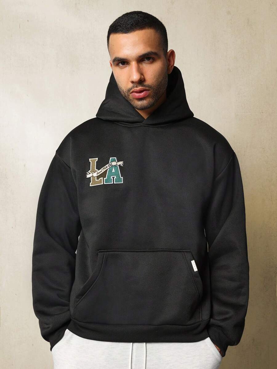 SUMWON Sudadera con capucha con bolsillo tipo canguro, estilo universitario, de peso pesado, con bordado de LA de lujo para atletismo, para otoño e invierno