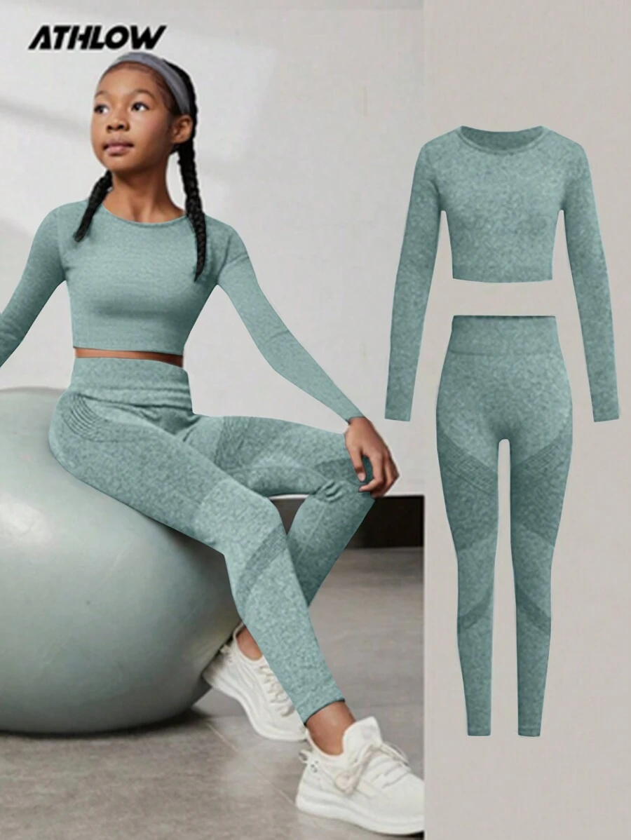 SHEIN Conjunto de ropa deportiva para niñas preadolescentes, blusa de manga larga negra y pantalones largos, traje deportivo elástico de yoga cómodo y transpirable, diseño minimalista y de moda