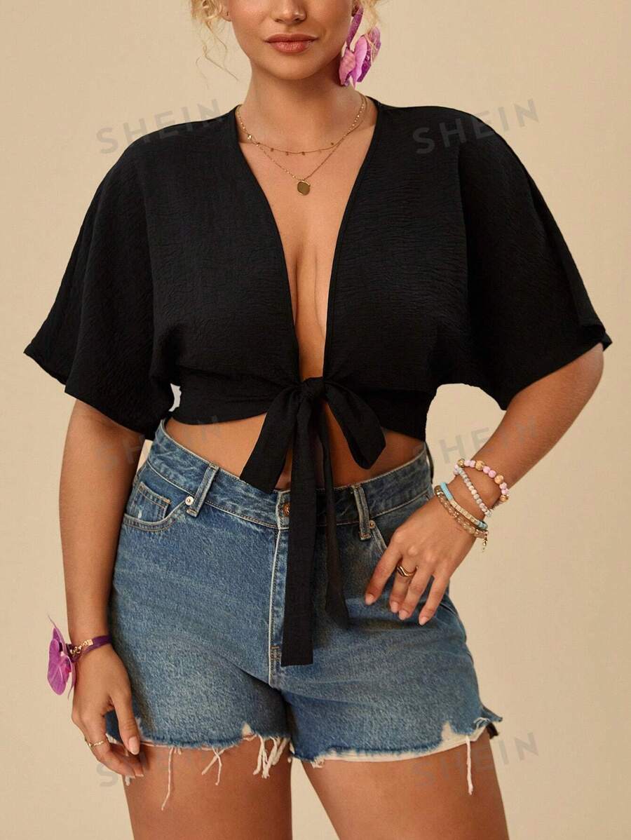 Travachic Camisa crop de manga murciélago con nudo delantero