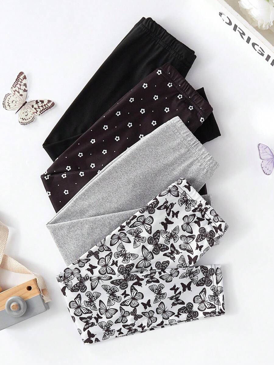 Set de 4 leggings largos con estampado de mariposas y flores todo sobre negro y gris para niña joven