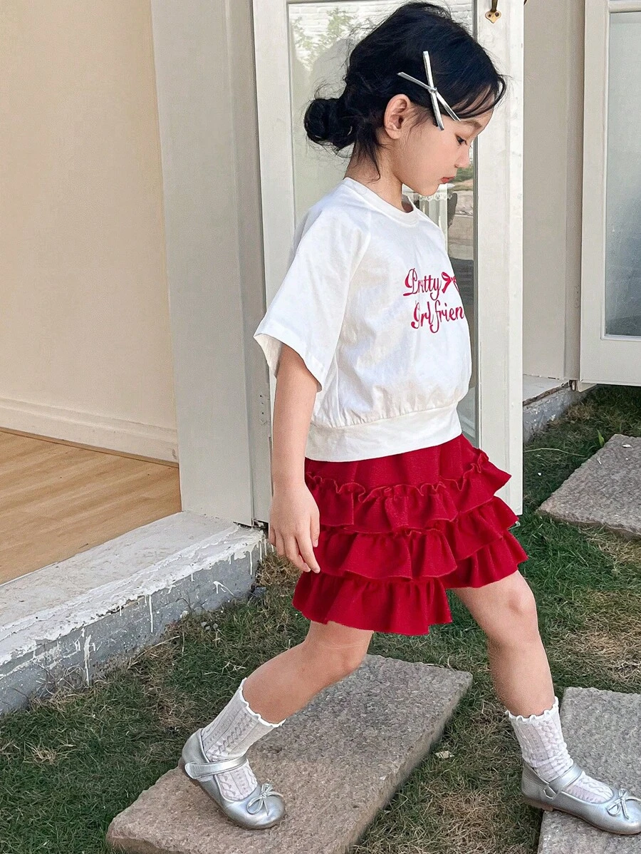 DAZY Set de 2 piezas con blusa de cuello redondo y manga corta con estampado de letras y shorts casual para niñas, conjunto de ropa de verano para niñas