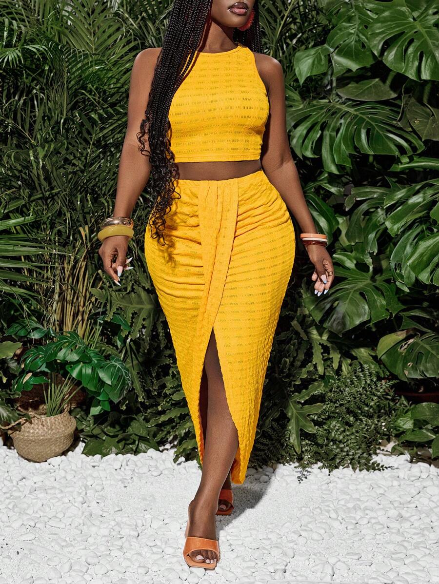 Slaydiva Nieuwe lente en zomer casual vakantie ronde hals mouwloos cropped vest + midden voorkant overlappende geplooide hoge split tot dij boog zoom asymmetrische zoom rok gele textuur stof dames tweedelige set