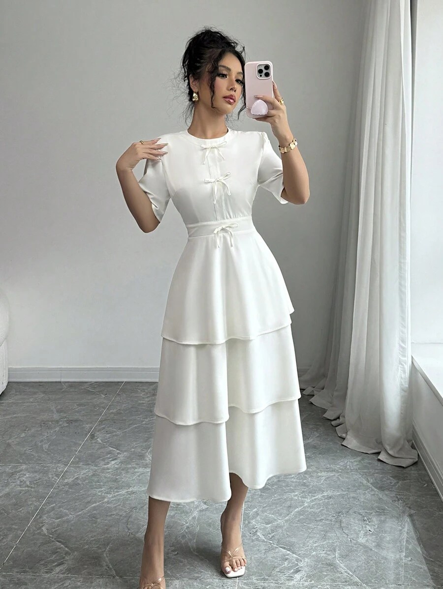 Elenzga Minimalistische effenkleurige jurk met strikversiering en taartzoom voor dames
