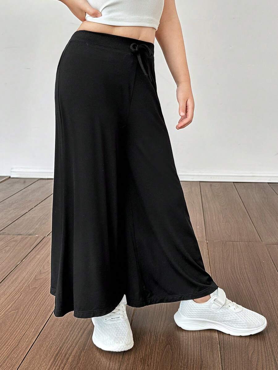 SHEIN Pantalones casuales sueltos y de un solo color de punto para niña