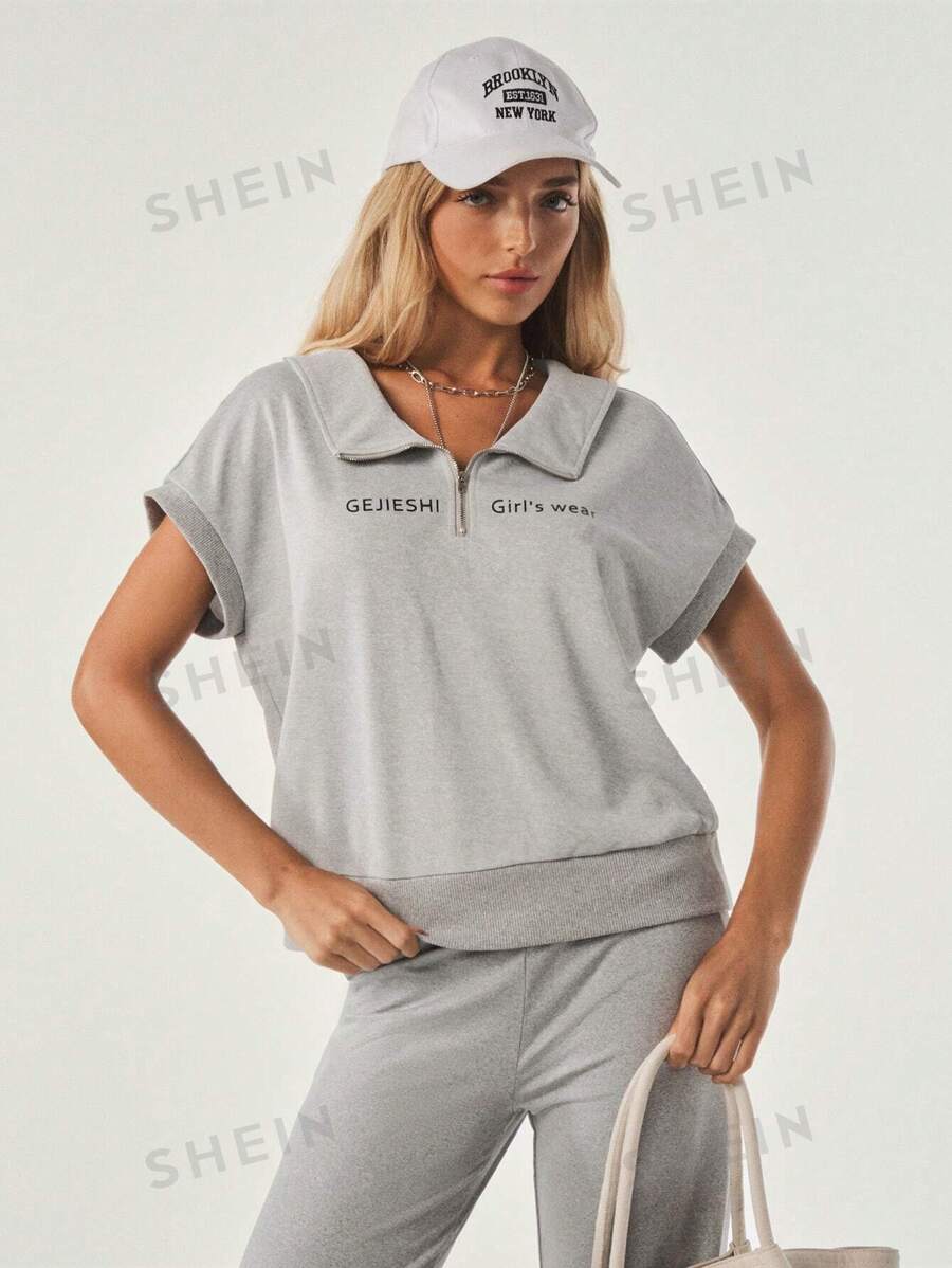 Tropiluxe Camiseta suelta de yoga y fitness con hombros en oblicuo para mujer, camiseta deportiva de manga corta ideal como cubrimiento para correr