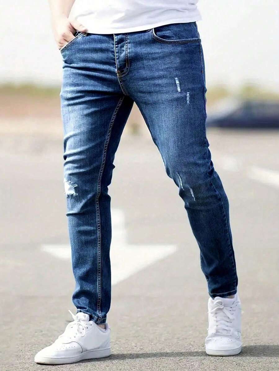 Manfinity Homme Jeans de mezclilla casuales con bolsillo y rotos simples talla grande para hombres