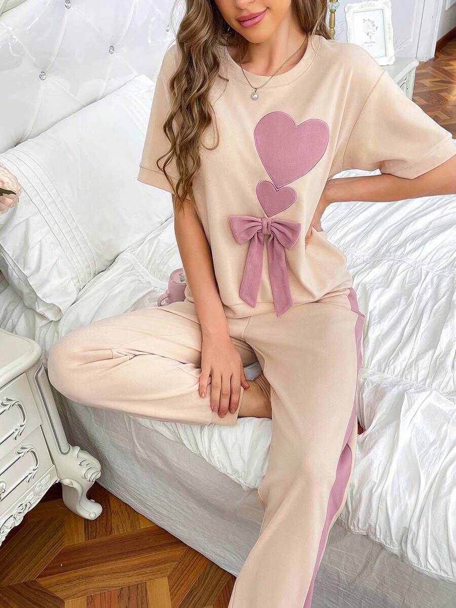 Conjuntos de pijama de mujer de manga corta con lazo, bordado de corazón y color contrastante de corte holgado
