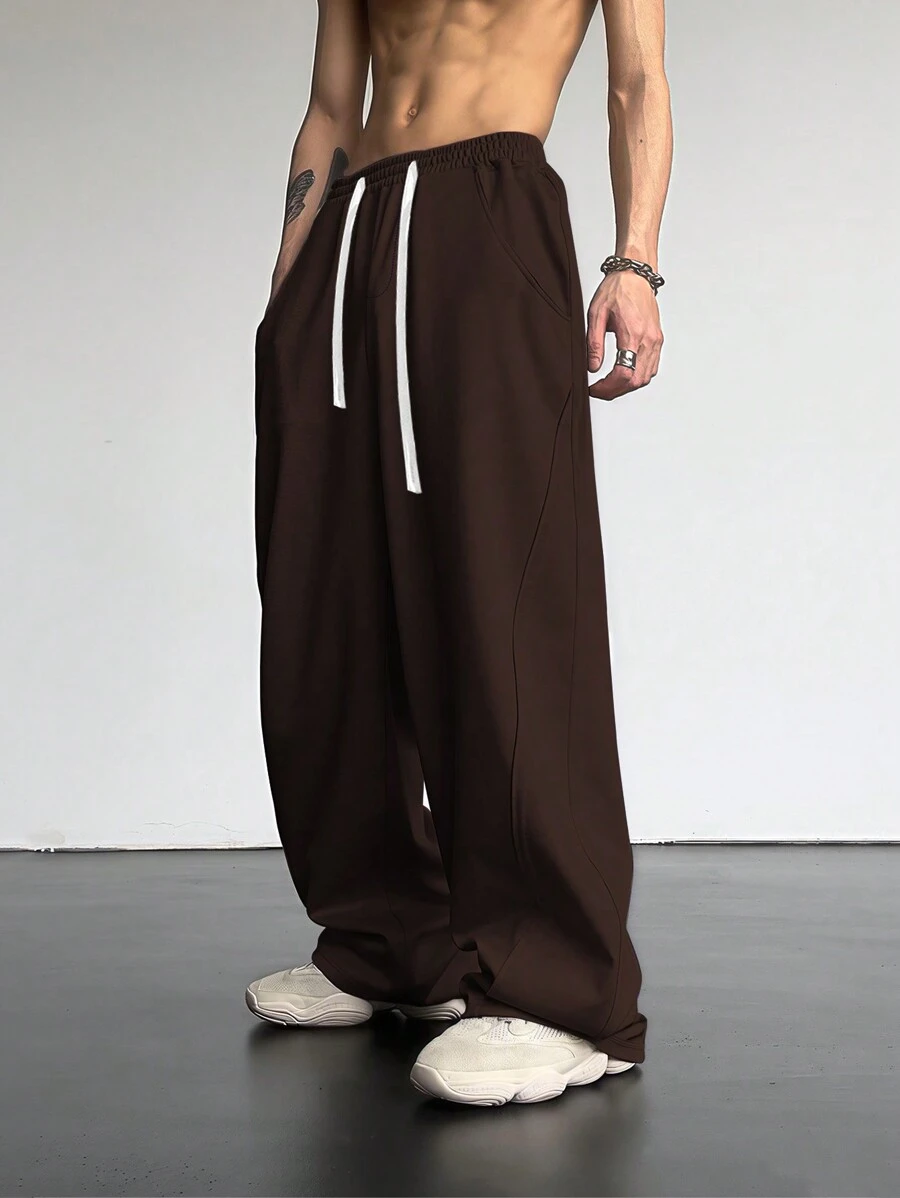 Manfinity Hypemode Pantalon de survêtement ample pour hommes avec cordon de serrage à la taille et poches en biais