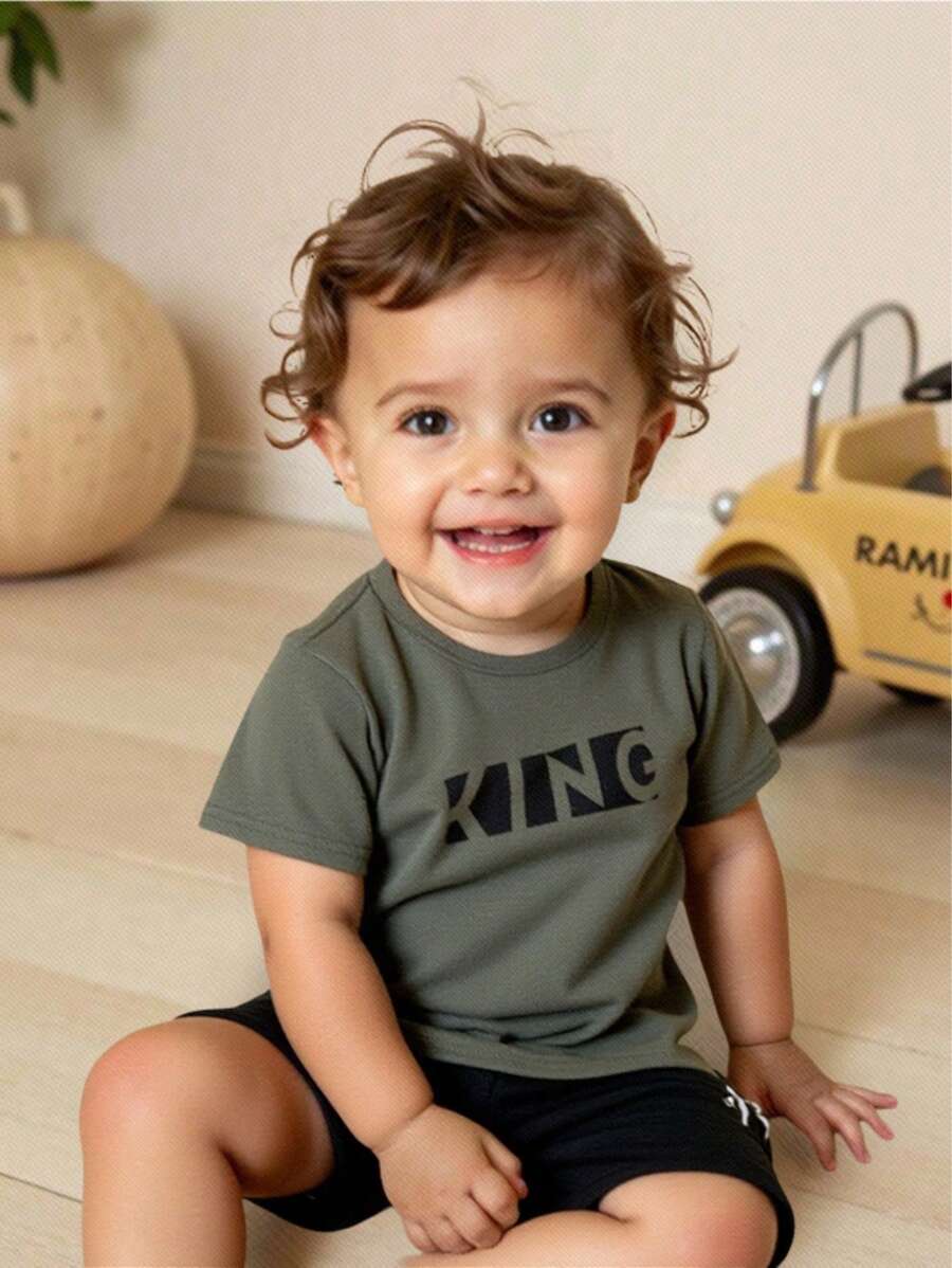 SHEIN Set de 2 piezas de top de manga corta de cuello redondo suave de punto y pantalones cortos de cintura elástica para bebé, niño o niña