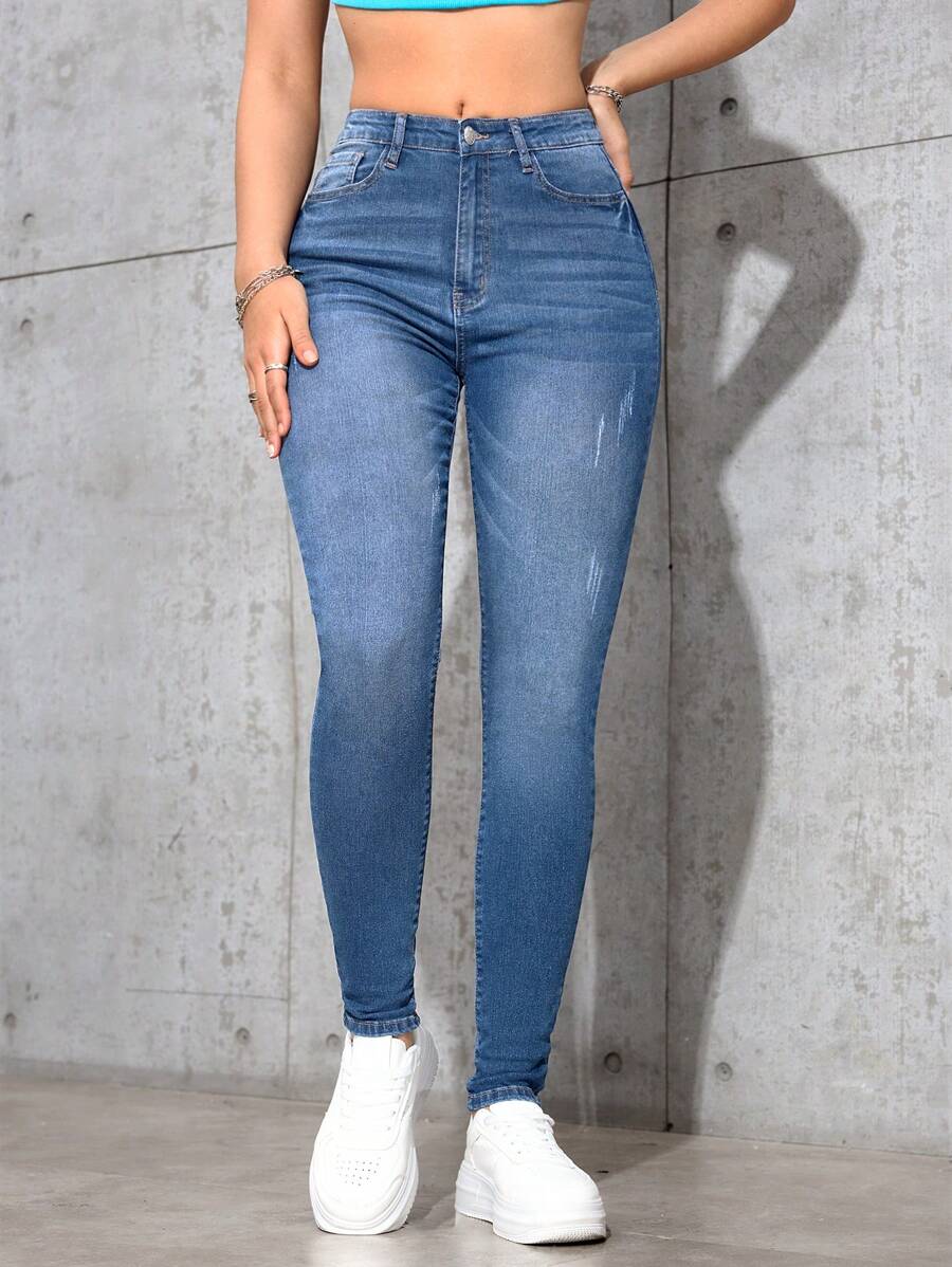 SHEIN Essnce Jeans de ajuste delgado con efecto lavado, estilo minimalista casual