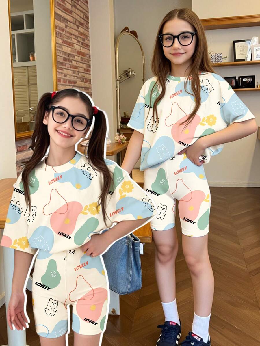 SHEIN Set de 2 piezas con camiseta de manga corta y shorts con estampado de grafiti y dibujos animados para niña preadolescente, adecuado para el verano