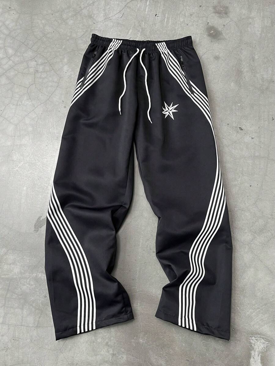 Manfinity EMRG بنطلون رجالي فضفاض بخصر مرن بطبعات نجوم وخطوط، موسم الخريف