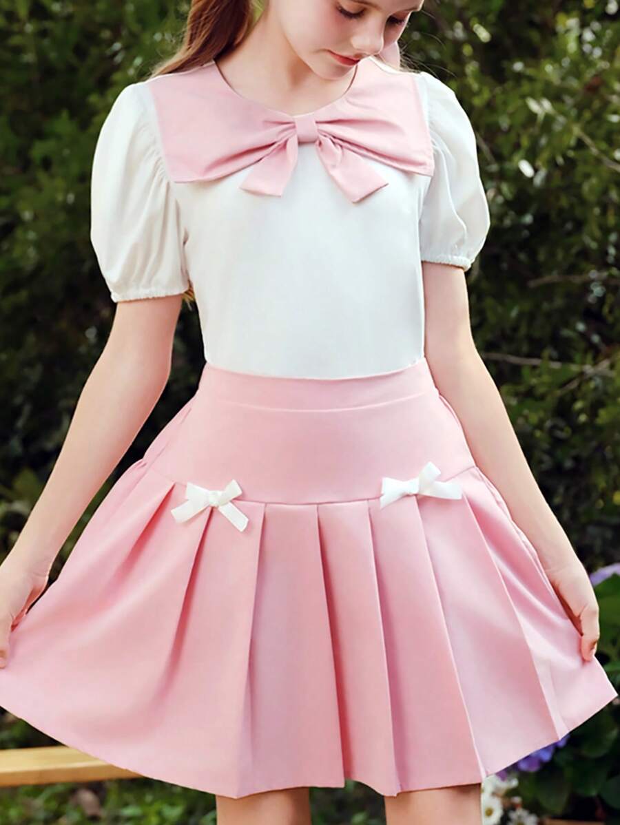 Wildeya Tween-Mädchen 2-teiliges Set, weiße Bluse mit Rüschen, Puffärmeln, Schleifenkragen und rosa Minirock mit Falten, Frühling/Sommer