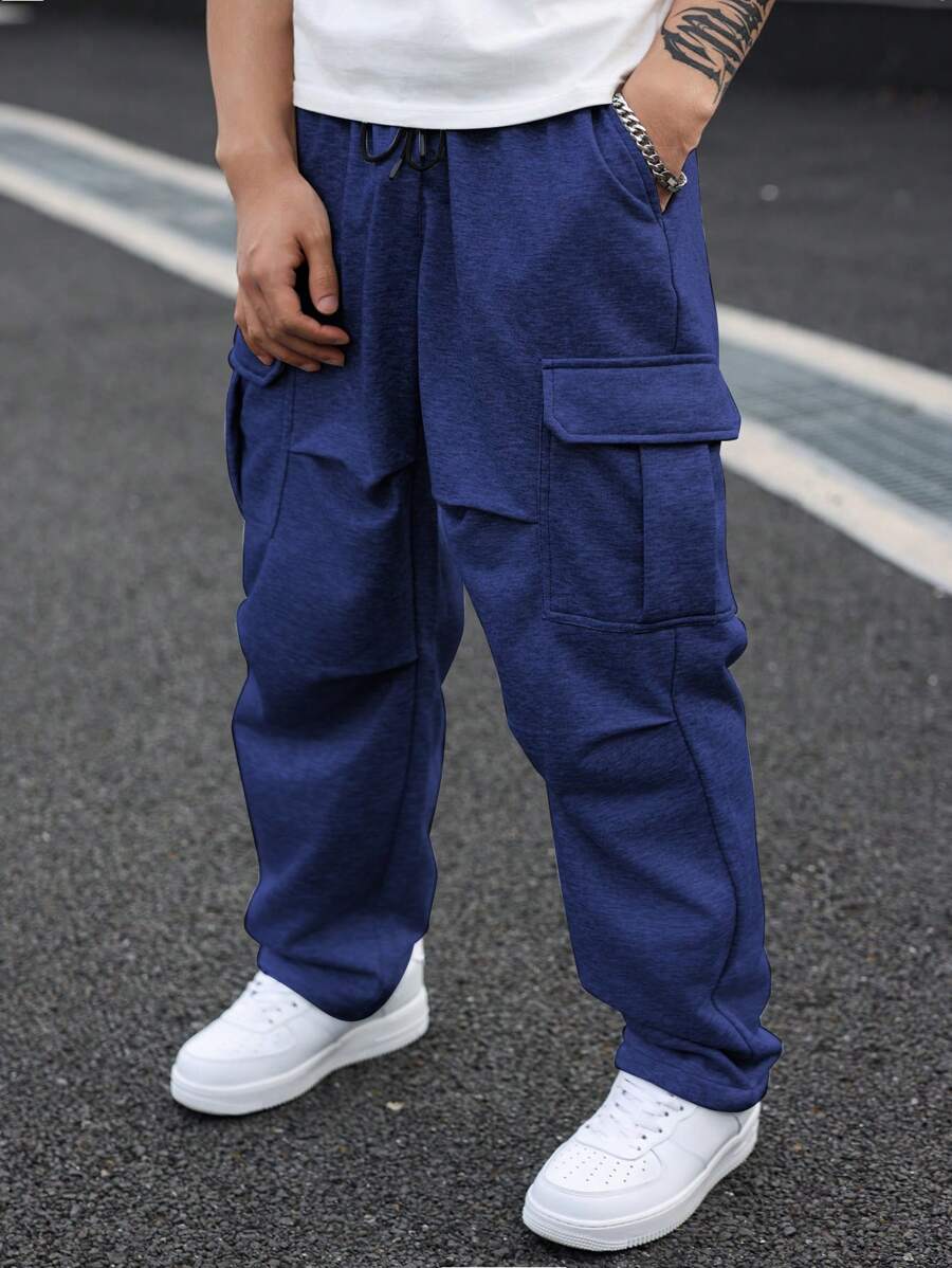 Manfinity Homme Spodnie dresowe męskie w jednolitym kolorze, kieszenie cargo, plisowane, szerokie nogawki, plus size