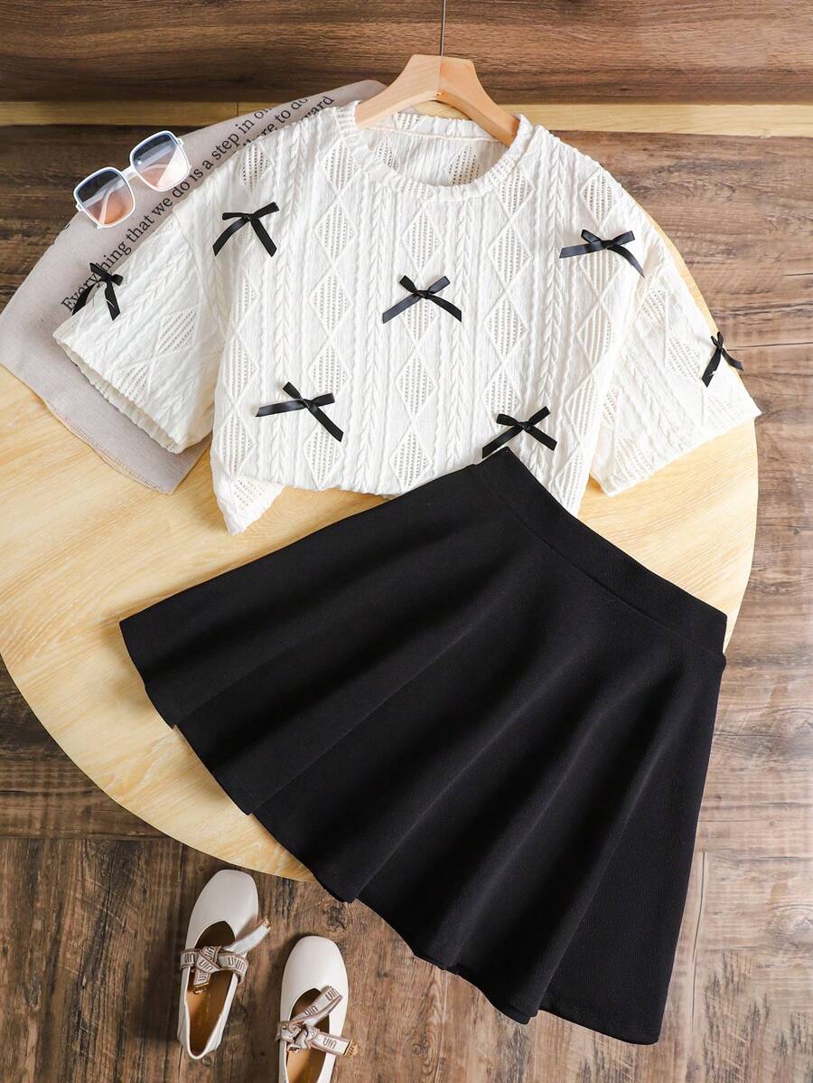 SHEIN Teen Girls Casual With Bow Decoration & Woven Solid Color Loose Round Neck Short Sleeve T-Shirt & Black Casual Skirt Set,Suitable For Everyday Wear