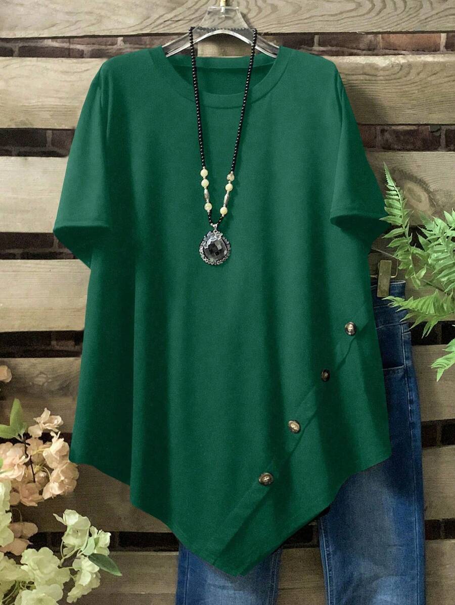 Camiseta holgada de mujer talla grande con cuello redondo, manga corta y bajo asimétrico en color liso