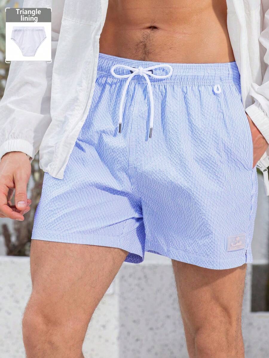 Manfinity Swimmode Shorts casuales de playa con bolsillo y atadura delantera a rayas para hombres