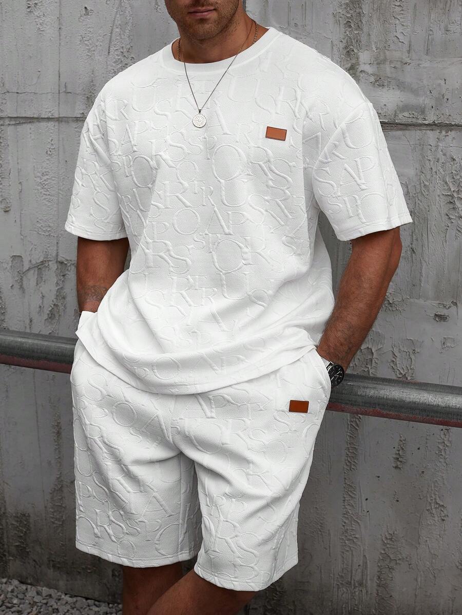Manfinity Homme Conjunto casual de camiseta y pantalones cortos bordados de tela texturizada para hombre de talla grande