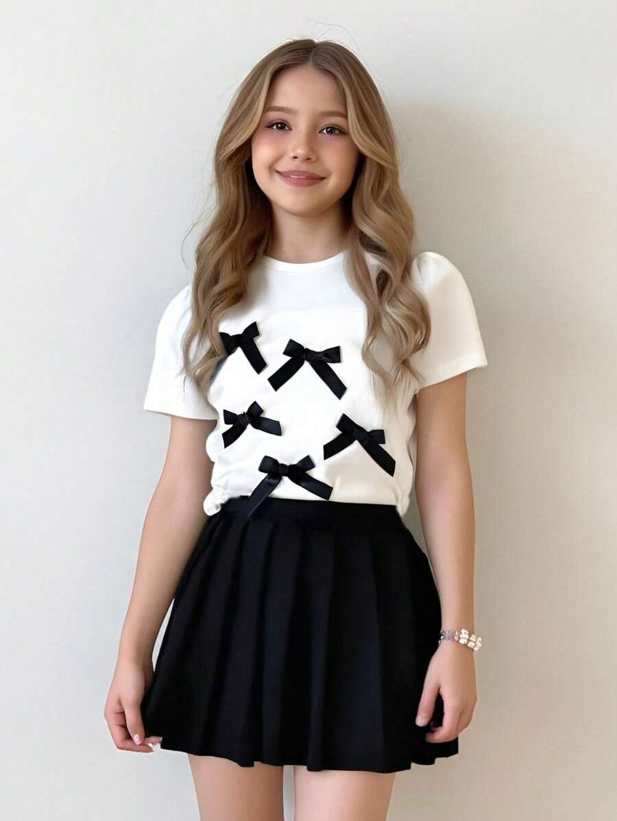 Wildeya Conjunto de 2 piezas de niña compuesto por Camiseta de punto de manga corta con cuello redondo y lazo 3D versátil y elegante + Falda plisada tejida