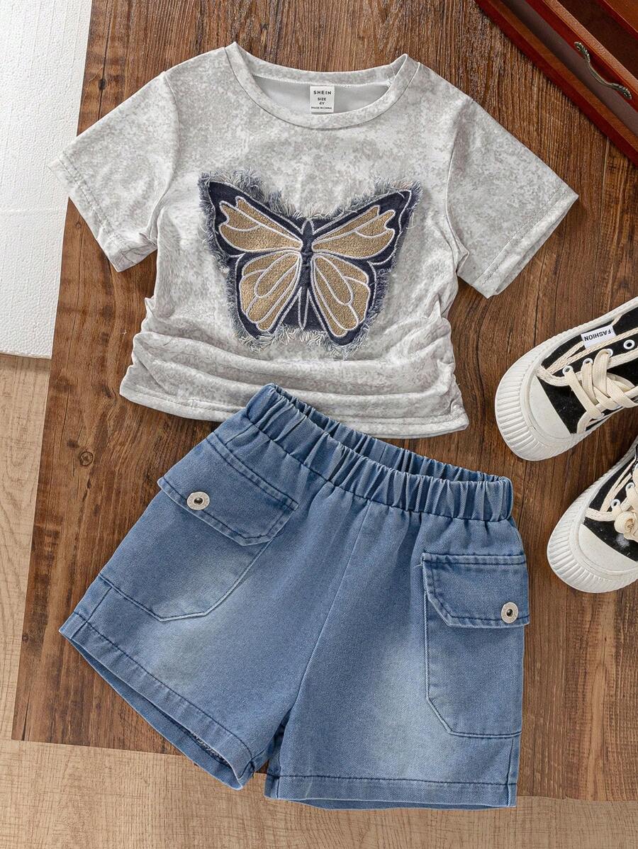 SHEIN Conjunto de 2 piezas para niñas jóvenes: Camiseta de manga corta con parche bordado de mariposa en denim y shorts cortos de denim con bolsillo