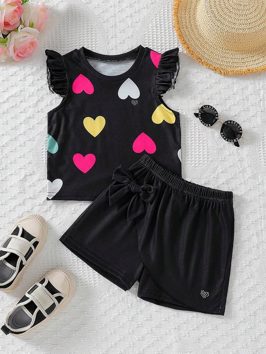 Set de 2 piezas de Top de manga corta con estampado de corazón colorido y falda corta con decoración de moño para niña, conjunto de vestir de verano