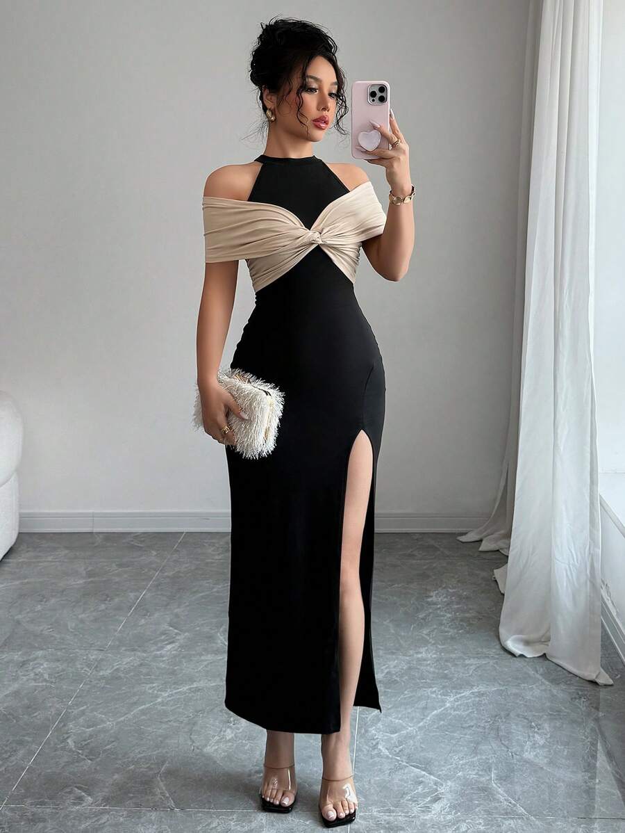 Calvaya Elegante abito color block nero e beige con spacco alto sulla schiena
