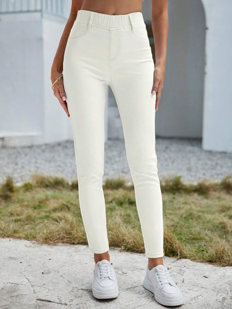 SHEIN Essnce Jeans casuales versátiles de cintura elástica con bolsillos para mujer
