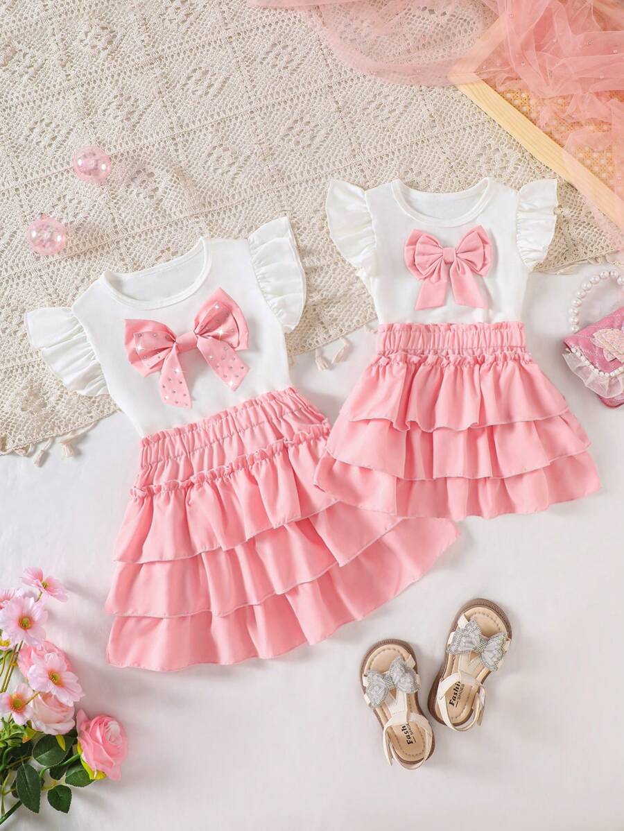 Conjunto rosa para niñas, camiseta blanca con lazo de strass desmontable, de moda y lindo, de tejido de punto, suave y cómodo, combinado con falda de pastel con volantes, cómodo y elegante, esencial para salidas de primavera/verano
