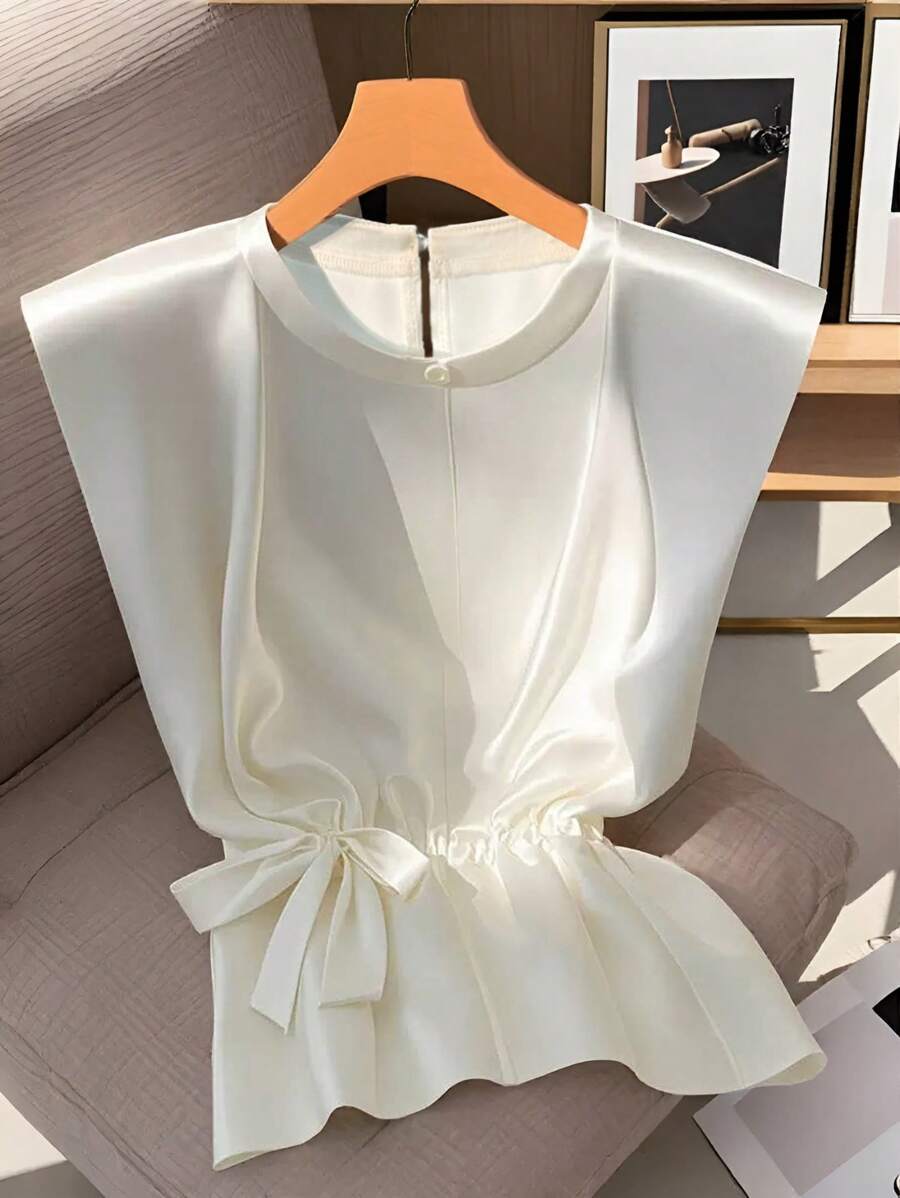 Franclia Blouse femme à la mode, polyvalente pour tous les jours, sans manches, col rond, taille cintrée, nœud papillon, brillante