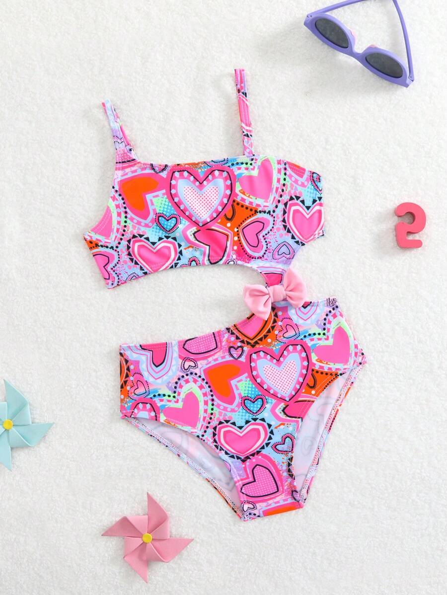 Traje de baño de una pieza con estampado de corazones y lazo para niña joven (diseño de estampado aleatorio)