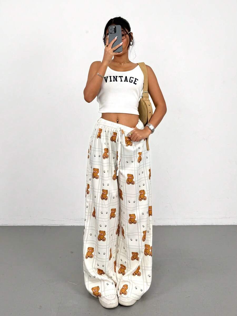 SHEIN PETITE Pantaloni a vita alta a zampa larga con cravatta in vita e motivo a quadri con orsetti cartooneschi per donne