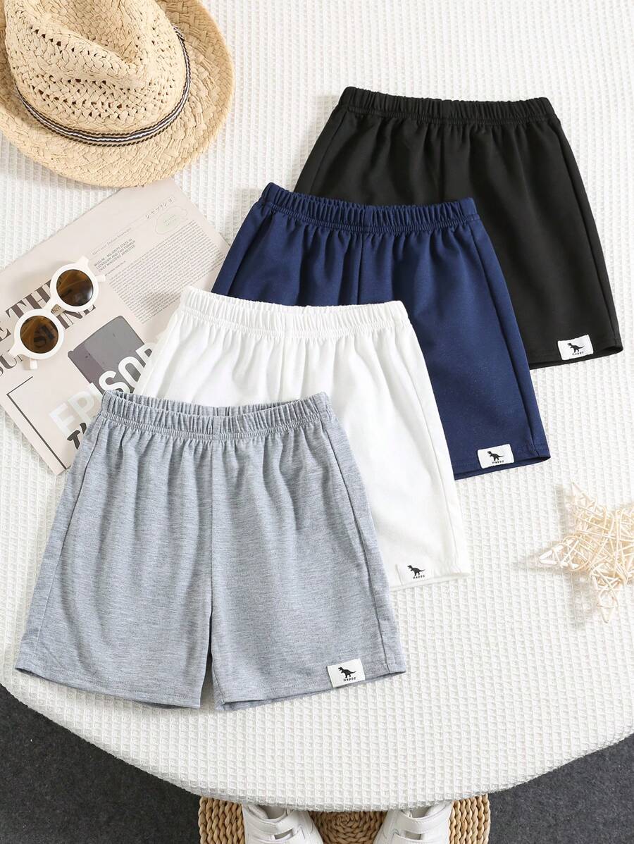 Set de 4 piezas de shorts cómodos, casuales y con estilo para niños, con decoración de insignia y cinturilla, aptos para uso diario, escuela, viajes y deportes en primavera y verano