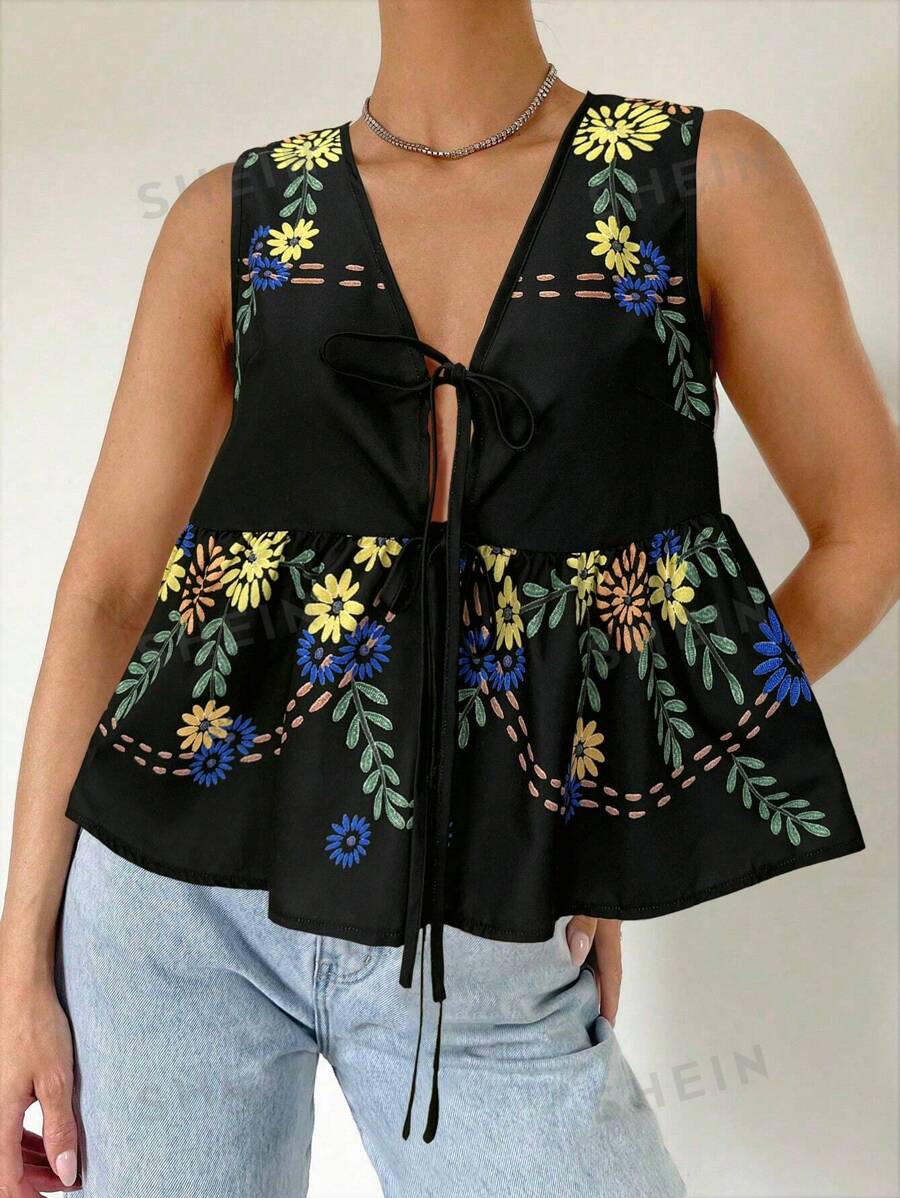 SHEIN Essnce Blusa de mujer holgada, ligera y transpirable para vacaciones de verano sin mangas con bordado y estampados impresos y con tirantes de lazada, cuello en V con lazo delantero, estilo bohemio y suave