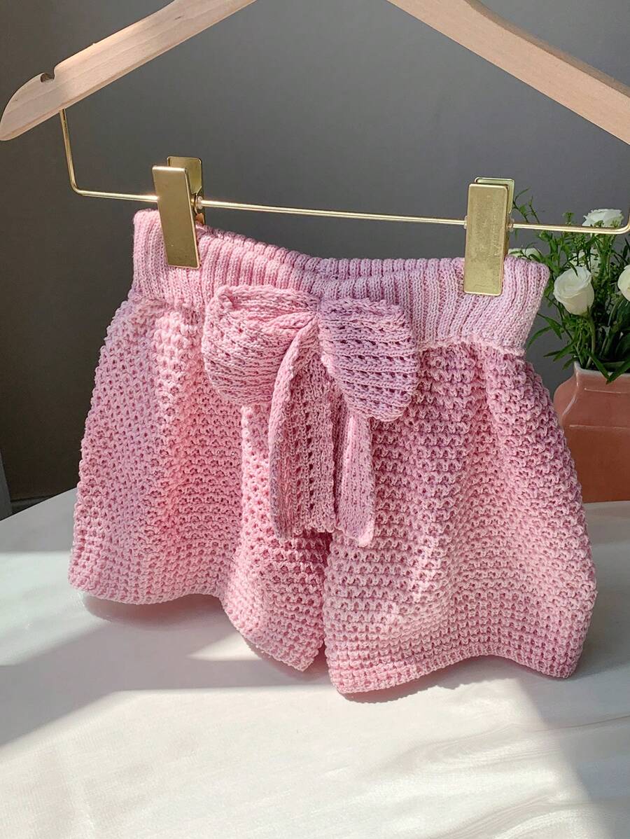 Comfortcana Shorts in stile vacanza al mare, a vita bassa, lavorati a maglia, con motivo a fiocco e design traforato