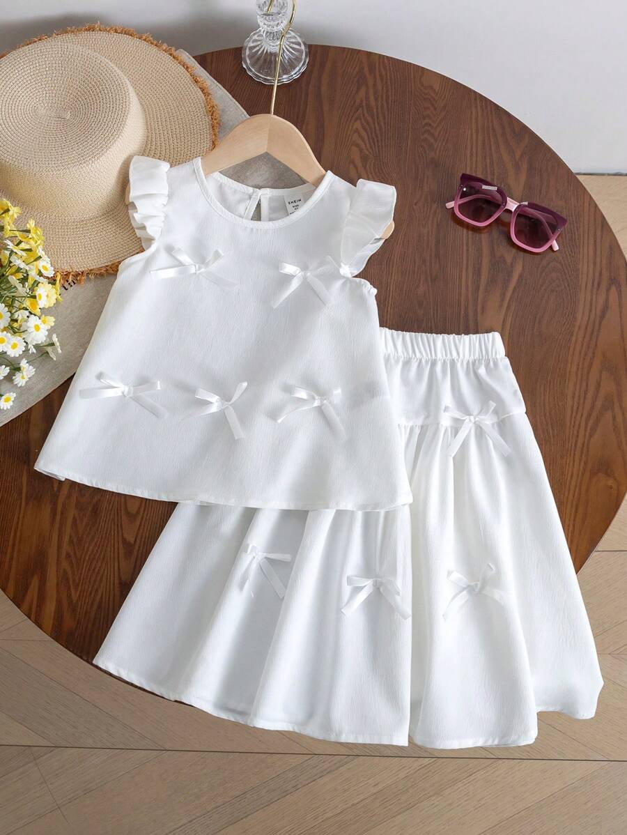 SHEIN 2pcs/Set Young Girl Fashion Cute 3D Bow Decor Round Neck Cap Sleeve Top And A-Line Skirt Suit, Versatile Daily Outfit Suitable For Spring/Summer, Vacation Holiday Travel Summer Relax