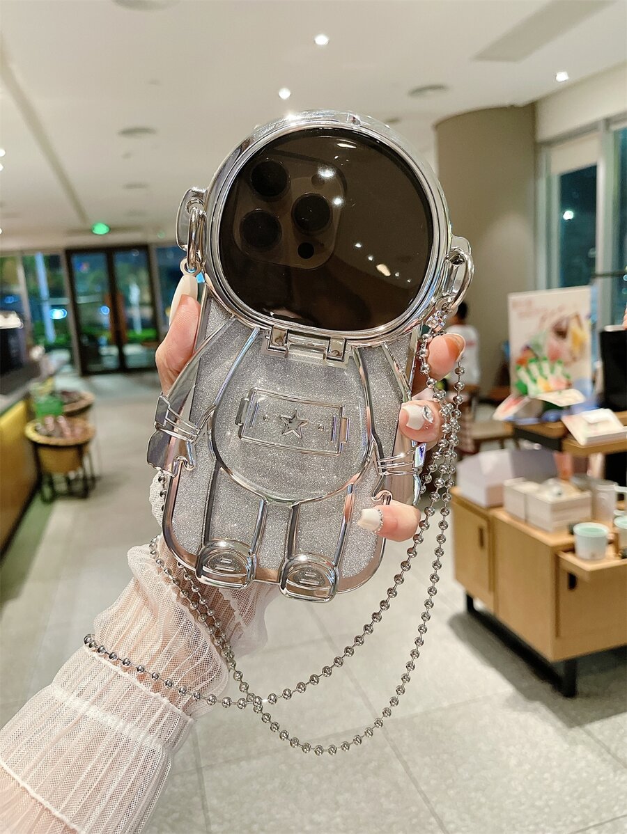 1pc Electroplated Astronaut-Shaped Phone Case With Cosmetic Mirror, Glitter, Kickstand, Fits For IPhone 11/11 Pro Max/12/12 Pro/12 Pro Max/13/13 Pro/13 Pro Max/14/14 Pro/14 Pro Max/15/15 Pro/15 Pro Max/15 Plus. The Electroplated Effect Displays Differently Under Various Lighting Conditions.