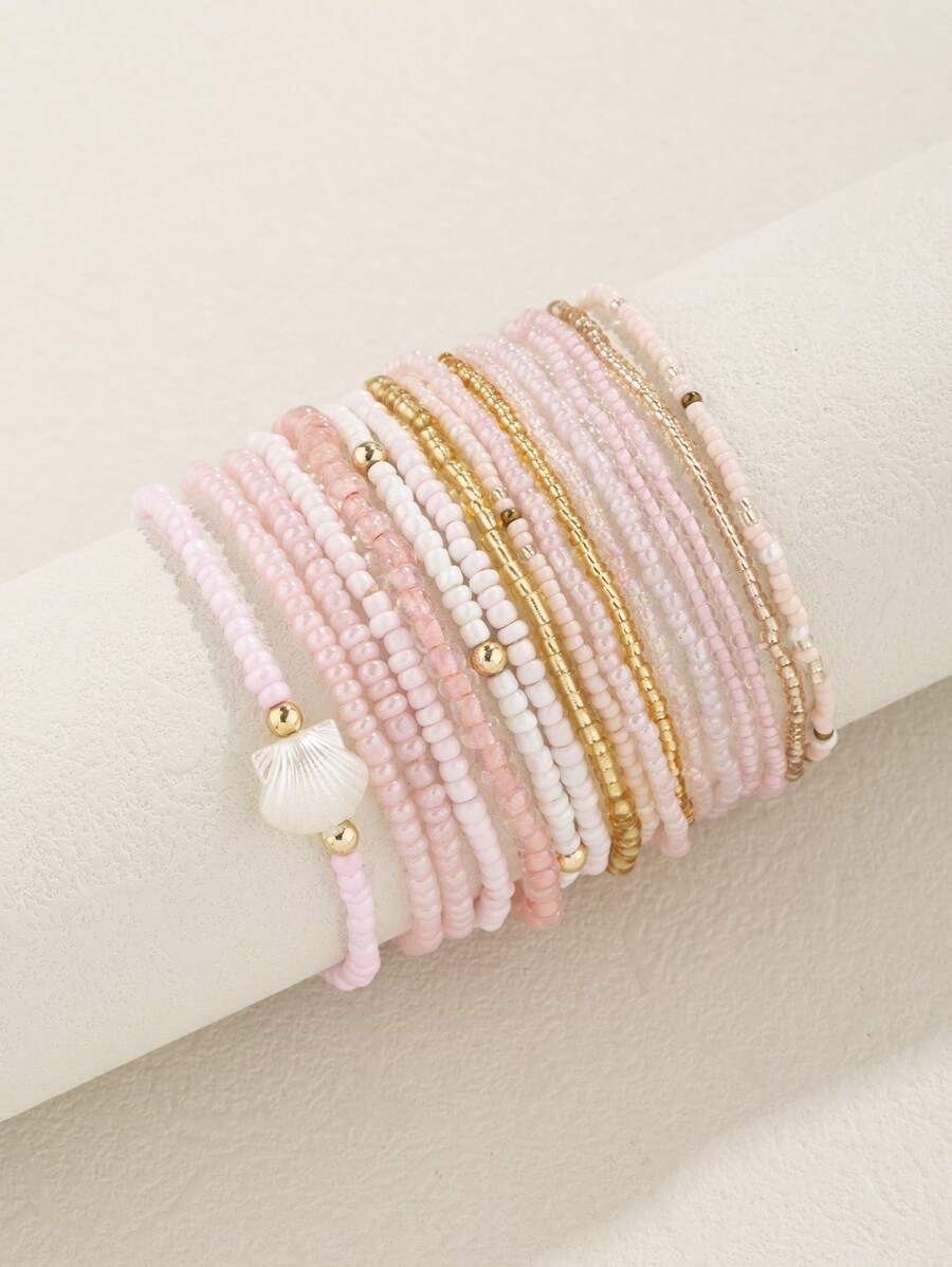 Conjunto de 17 brazalete apilable estilo bohemio con cuentas de vidrio y semillas en tono rosa para mujeres