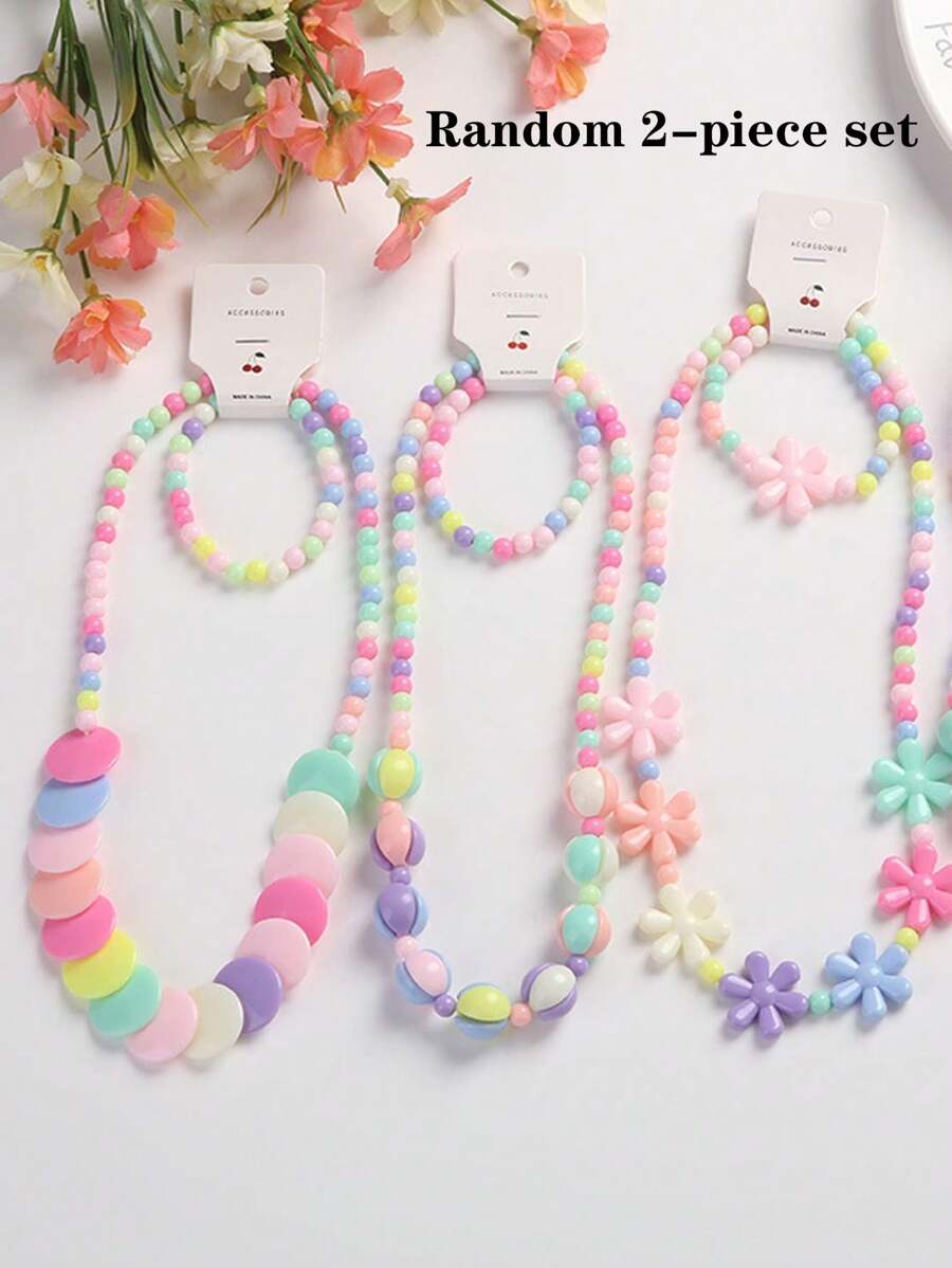 2 pièces le set : Collier et bracelet mignons de couleur bonbon, bijoux pour enfants avec perles, couleurs et design floral aléatoires