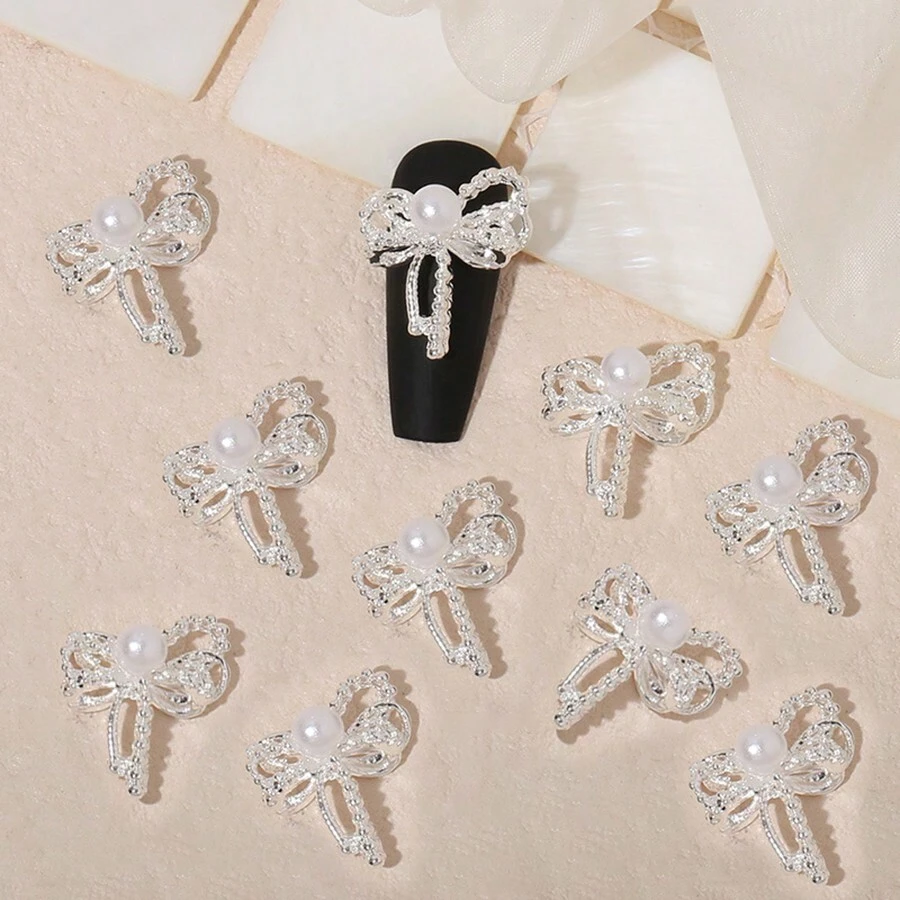 10 piezas de adornos de joyería de aleación de zinc en color plateado: moños, alfileres de cuello, decoraciones para arte de uñas, charms y gemas para uñas