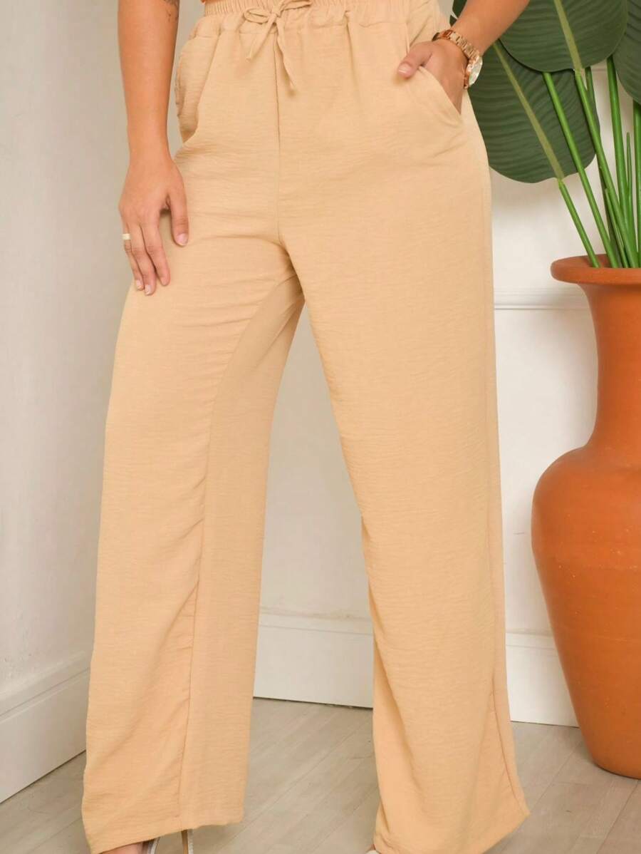 Calça Pantalona em Tecido DUNA com elástico.
