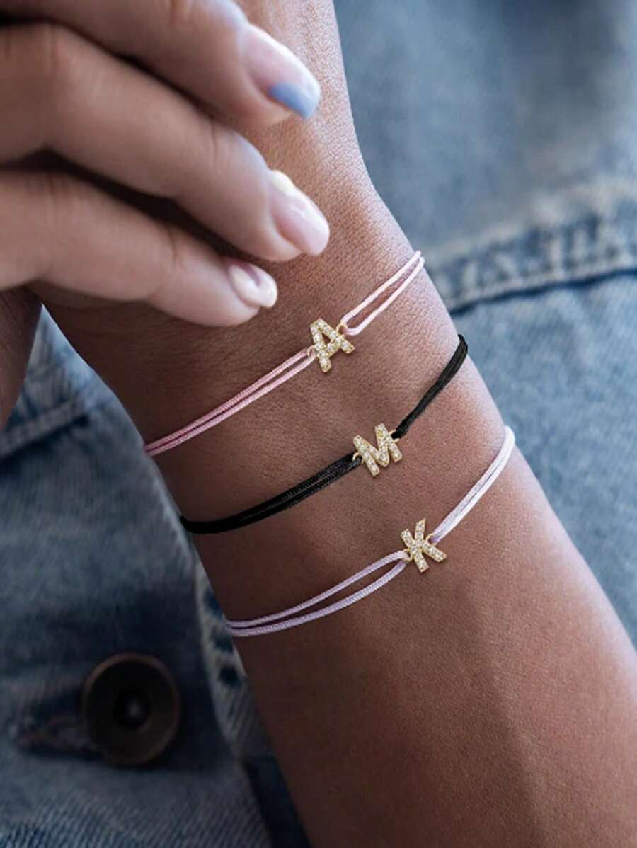 1 pièce Mode Micro-incrusté Cuivre A-Z, Nom de famille 26 initiales en anglais L'édition manuelle peut être ajustée à volonté La corde à la main Sweet Little Clear Creative Fille Quotidien Porter Anglais Initiales Bracelet Couleur de corde à la main correspondance aléatoire