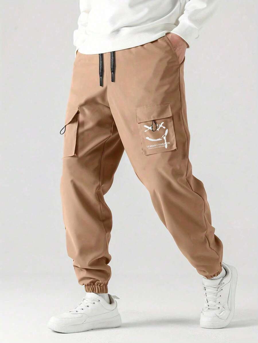 Pantalones de carga casuales con cordón en la cintura y estampado sonriente, de moda para niño preadolescente para la temporada de regreso a la escuela