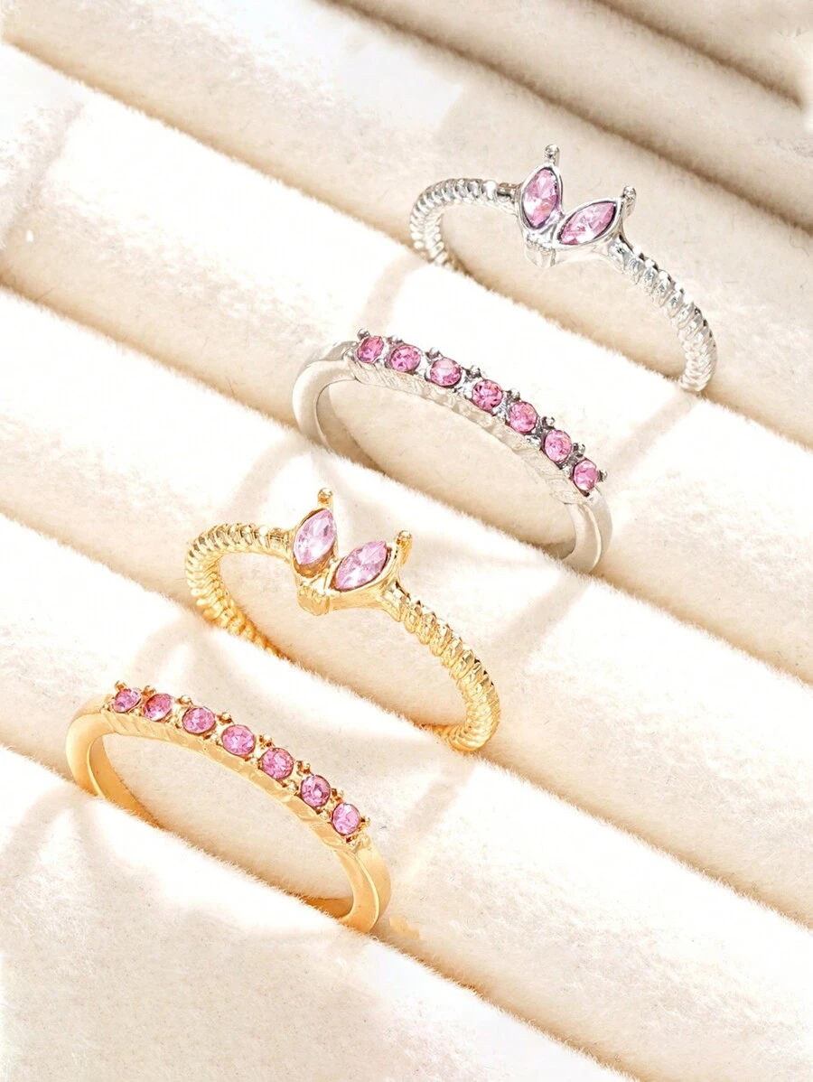 Set de 4 anillos ajustables con diseño de mariposa y corazón de cristal en tonos dorado y plateado, joyería para niña